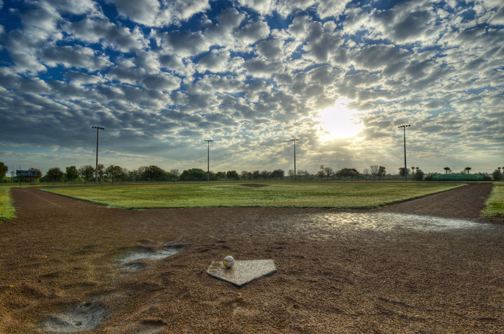 wet baseball field at sunrise
